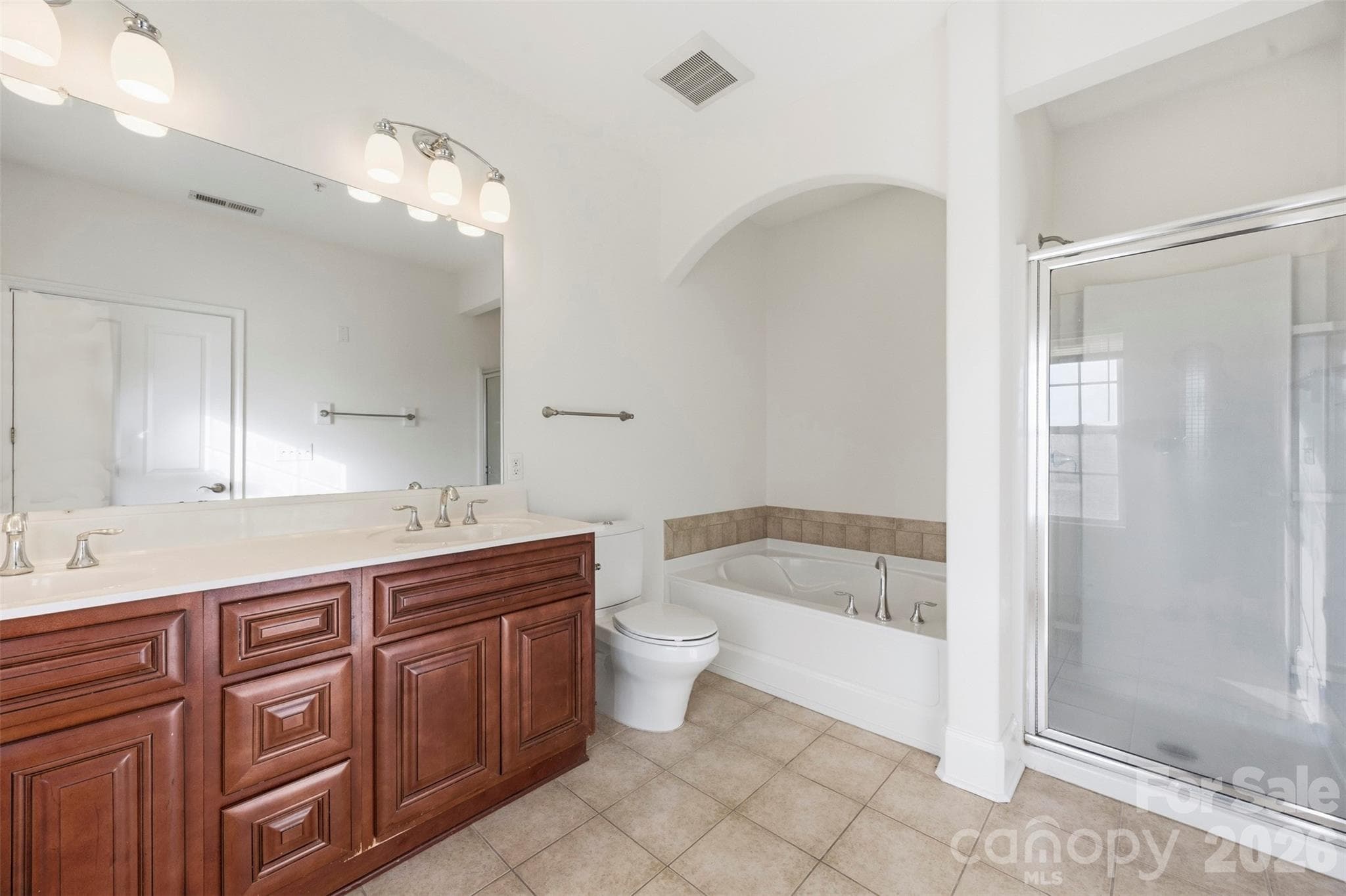 Owners bath, dual vanity and garden tub with separate shower. - 6605 Central Pacific Avenue, Charlotte