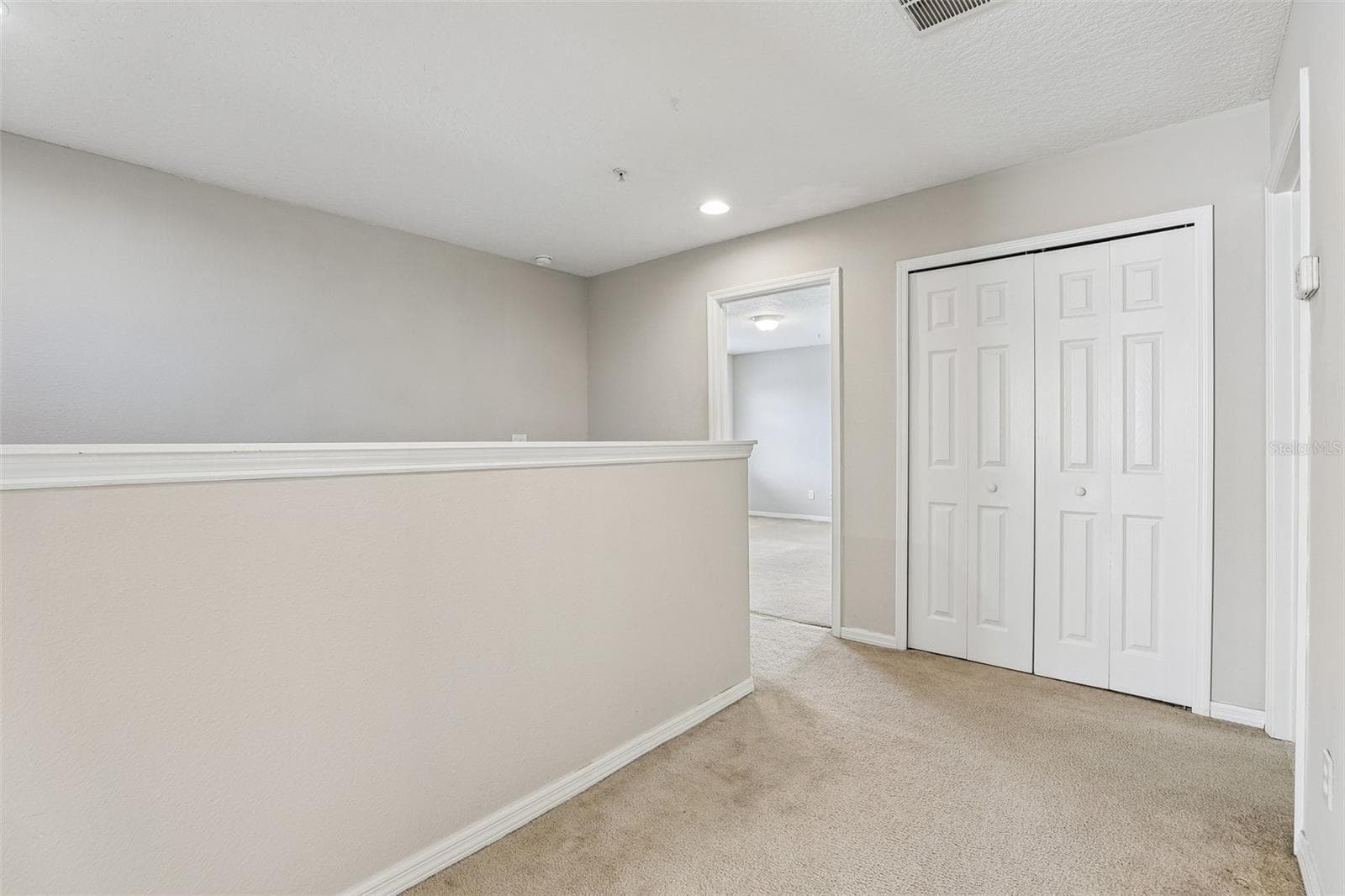 Second floor landing, storage closet. - 10411 KRISTEN PARK DR, ORLANDO