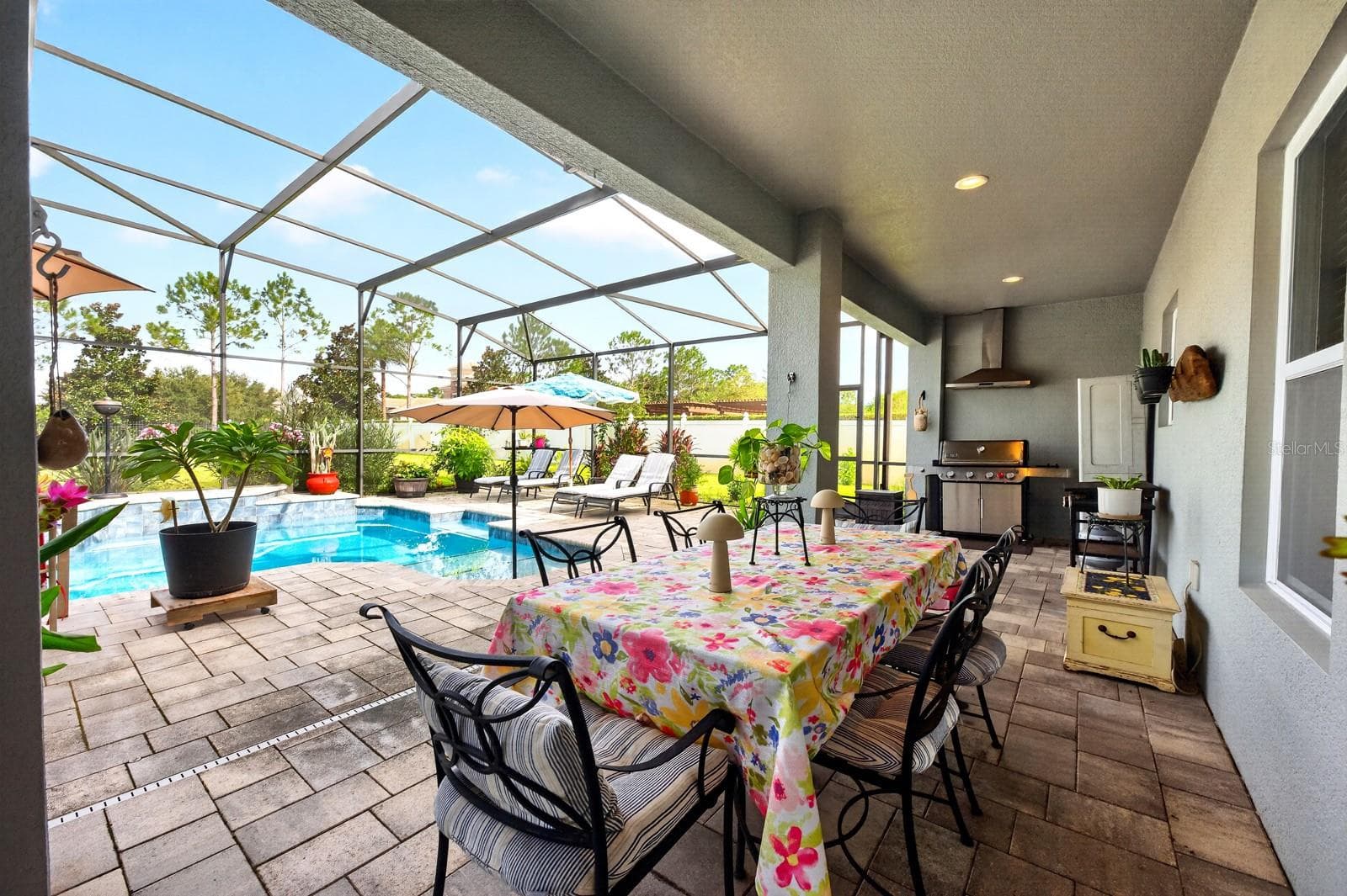 The covered lanai has an area for a summer kitchen. - 3135 AMALFI DR, ORLANDO