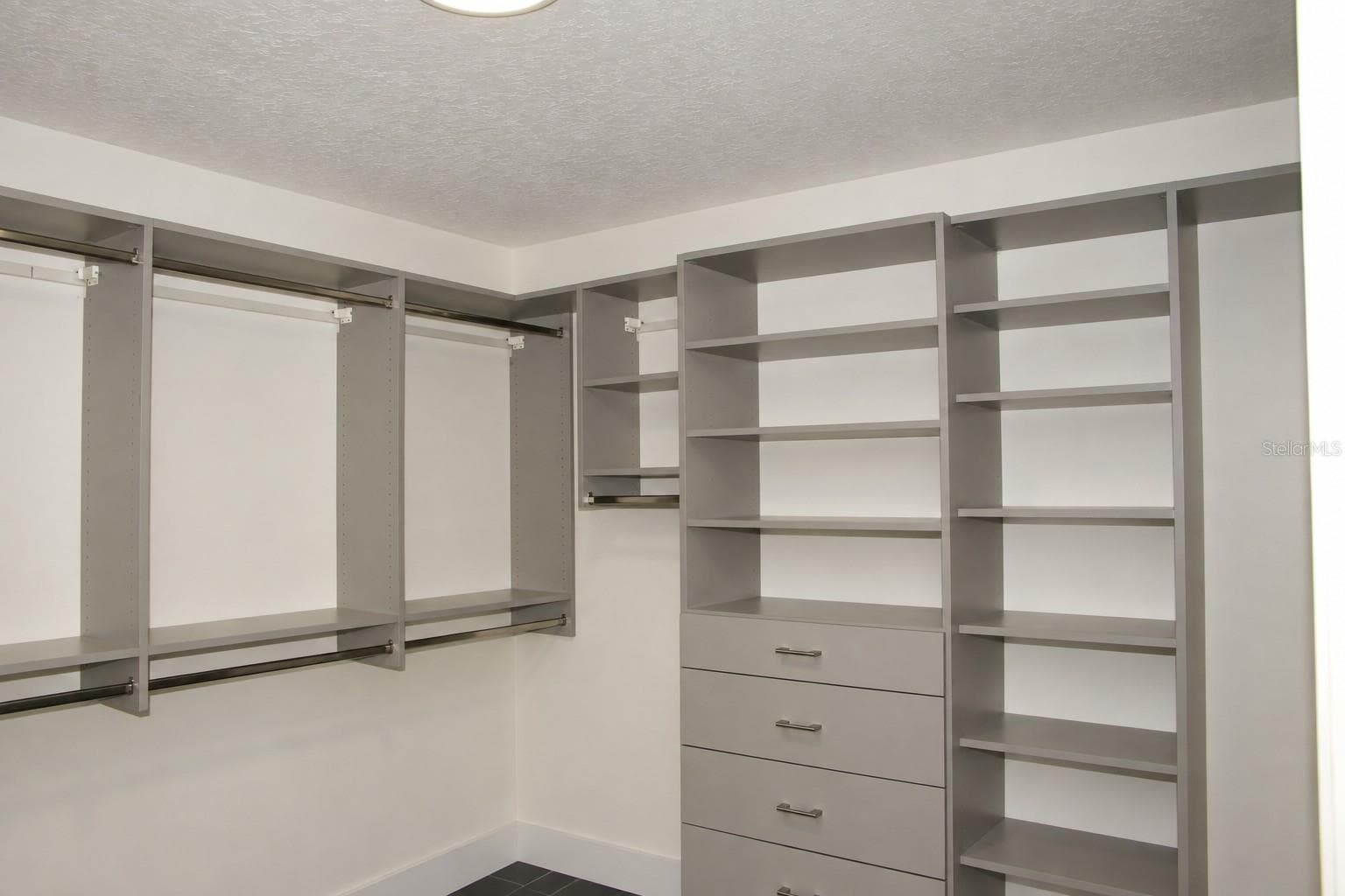 Walk-in closet with custom built-ins - 1 - 9865 SW 74TH AVE, OCALA