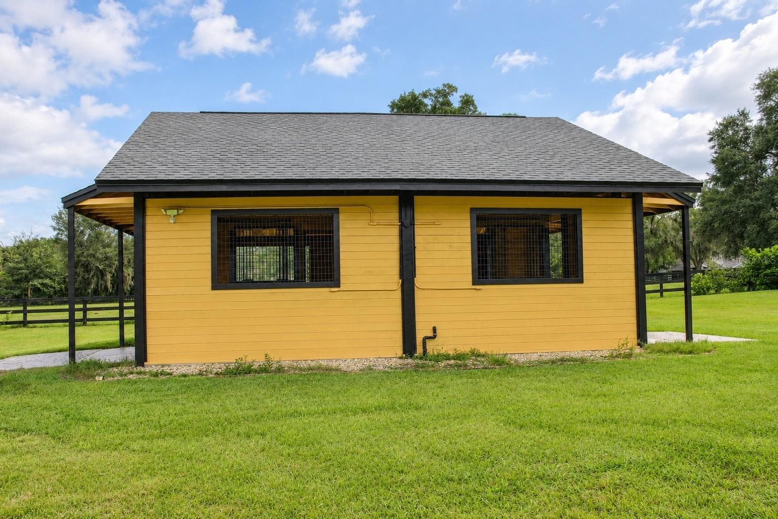 Symmetrical Yellow Stable - 9865 SW 74TH AVE, OCALA