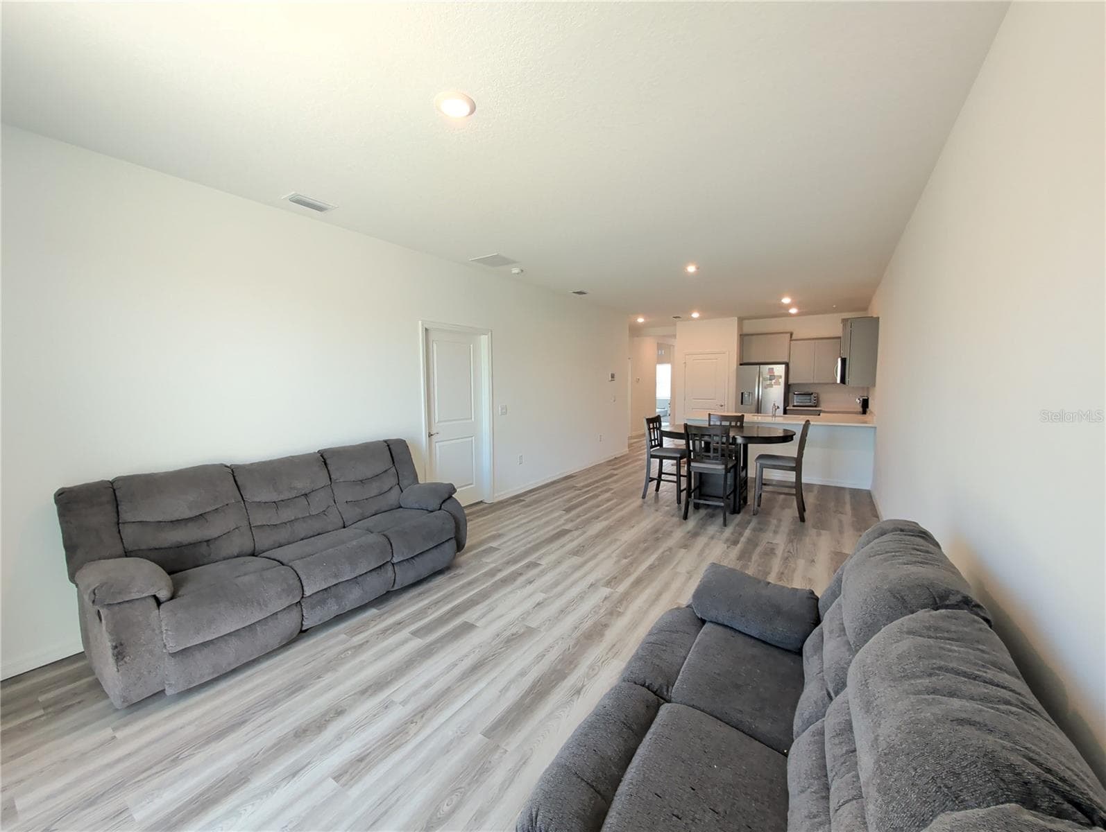 Great Room, Kitchen, Primary Bedroom door. - 4057 WESTWOOD FIELDS LOOP, PLANT CITY