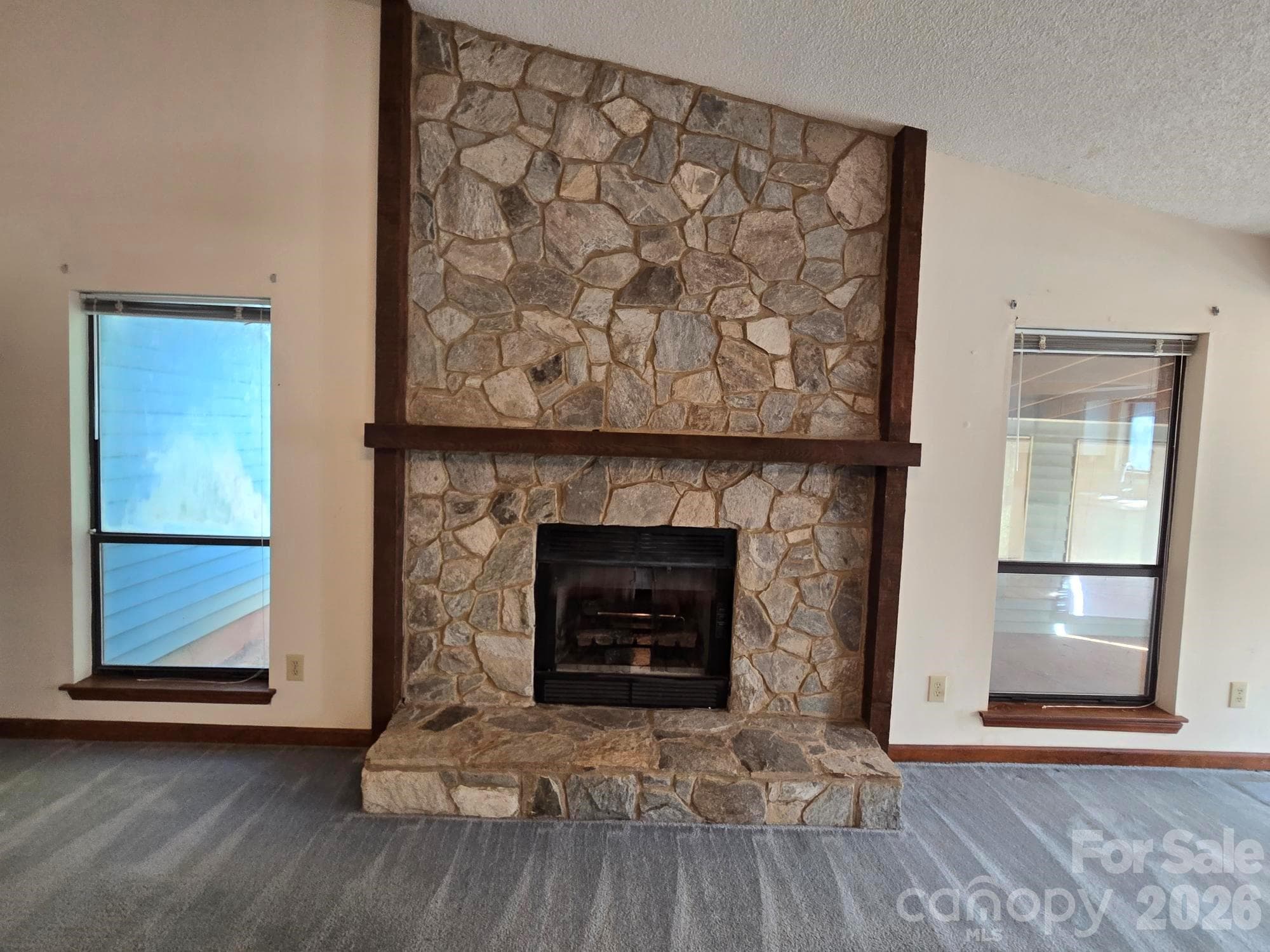 Stone Fireplace with gas logs. - 6214 Elkington Lane, Mint Hill