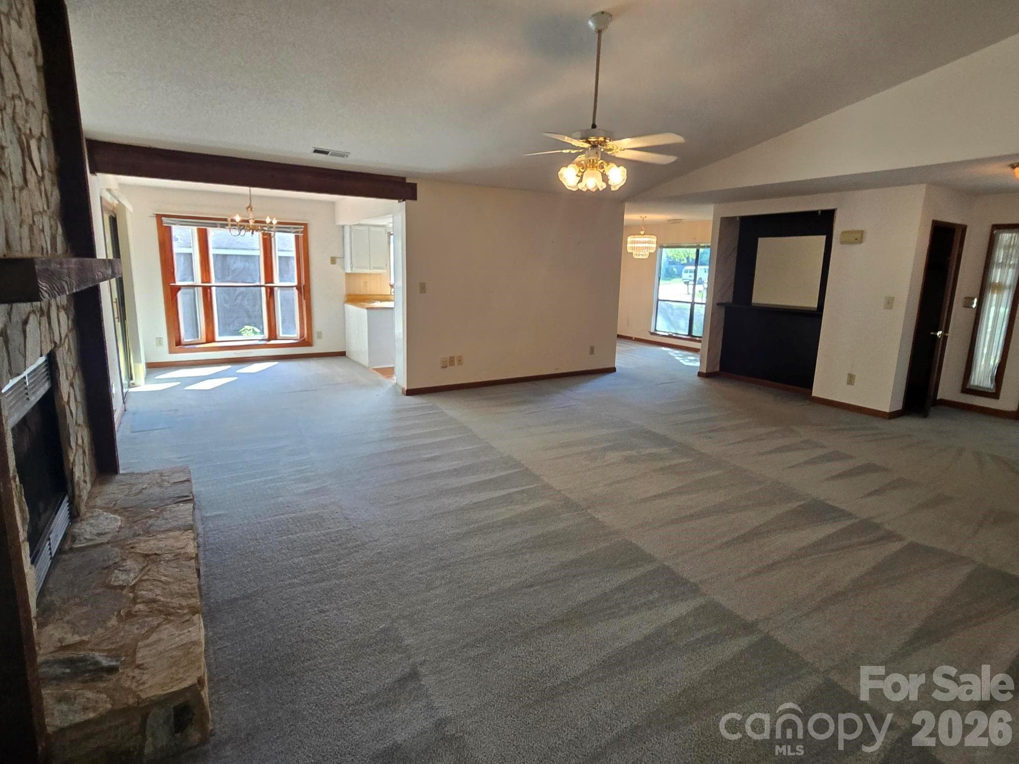 Living Room with Stone Fireplace and Gas Logs. - 6214 Elkington Lane, Mint Hill