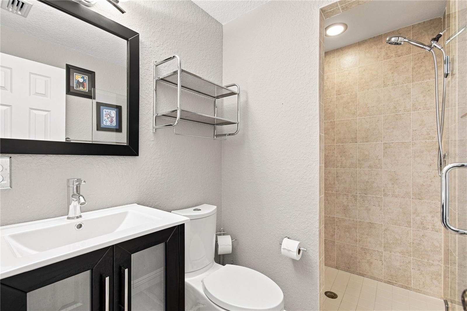 Modern guest bathroom with walk in shower. - 152 117TH AVE, TREASURE ISLAND