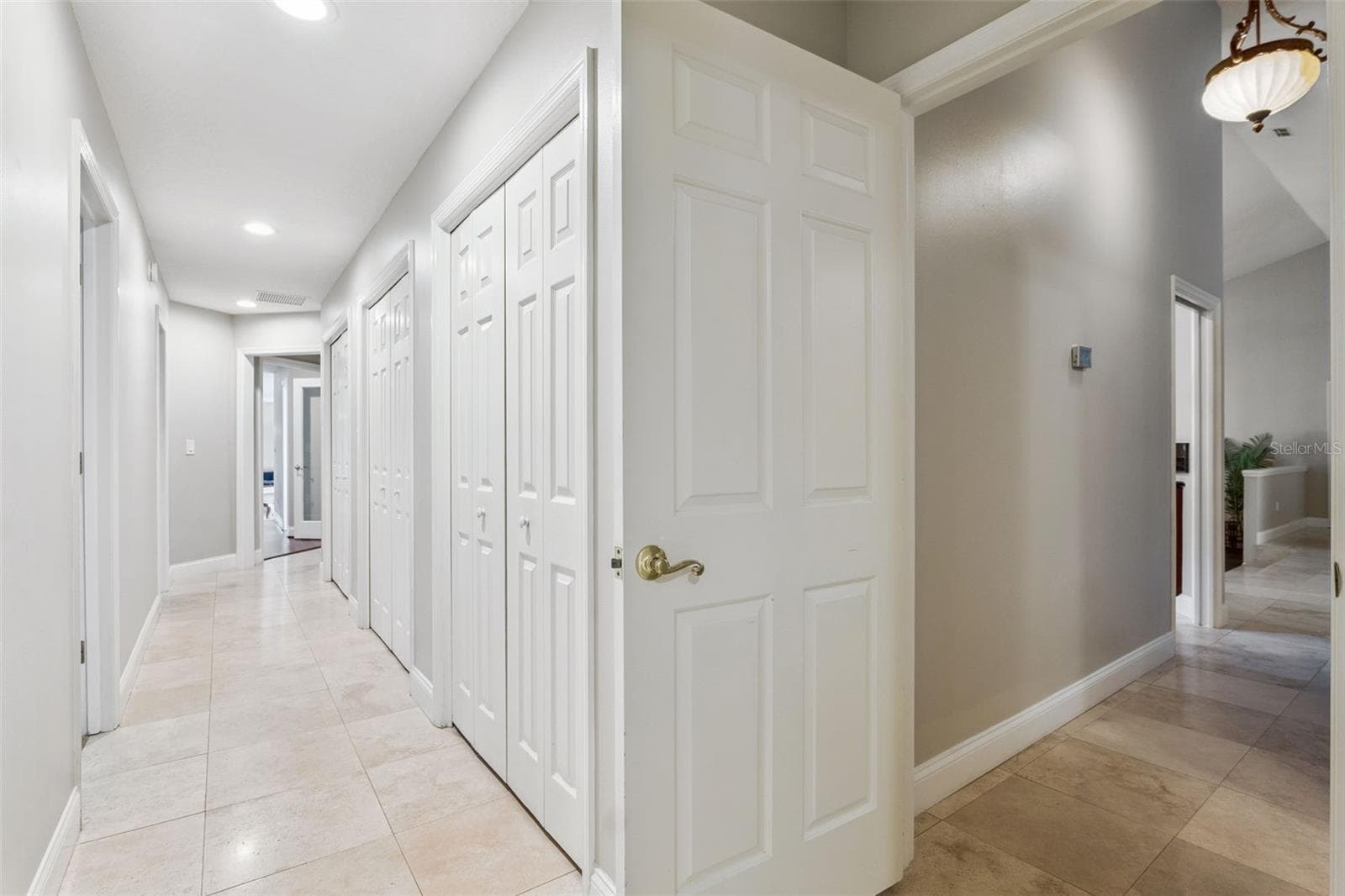 Hallway to two bedrooms and a jack and a jack and Jill on first floor - 333 BRANTLEY CLUB PL, LONGWOOD