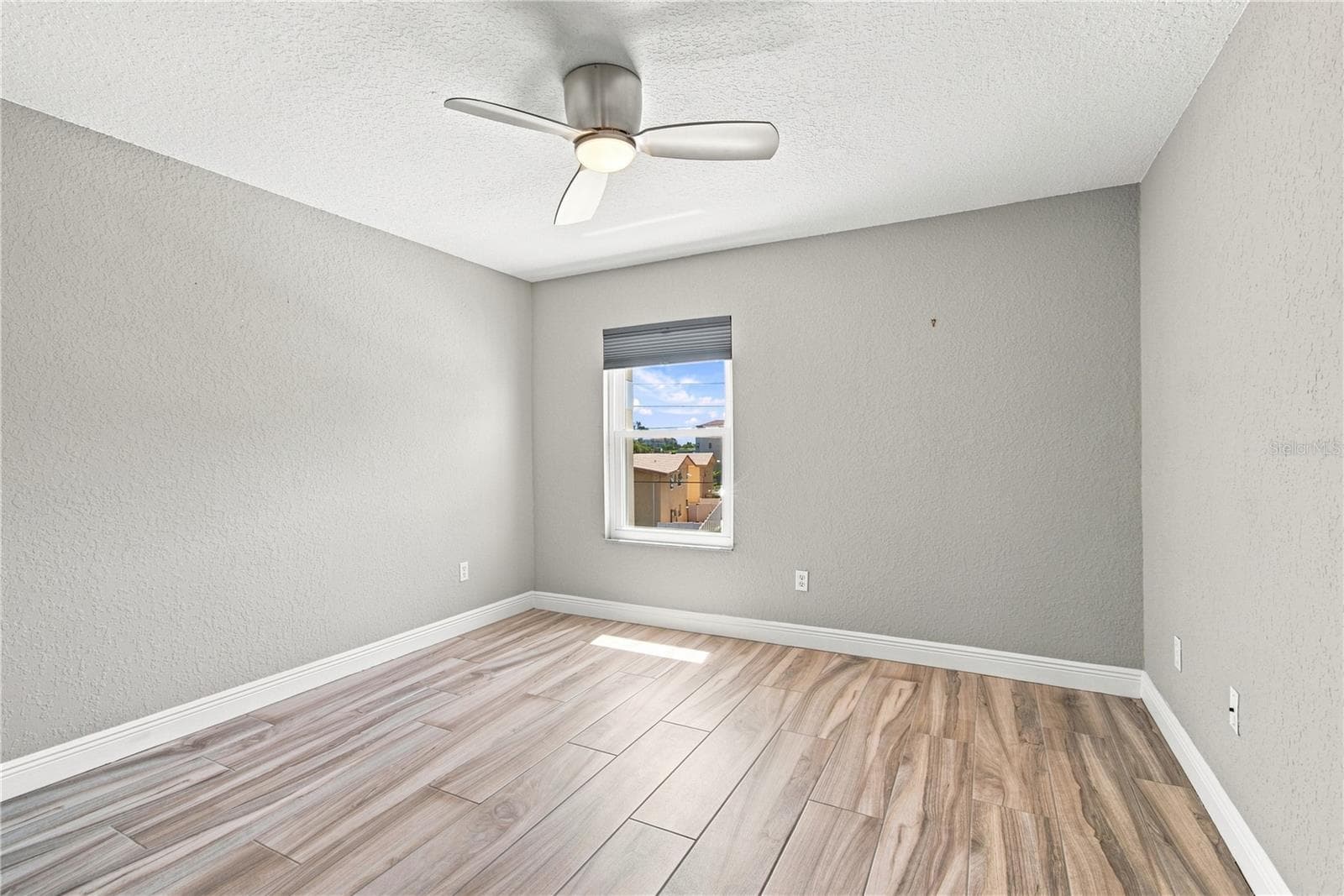 Gorgeous, driftwood style porcelain tile flooring throughout - 152 117TH AVE, TREASURE ISLAND