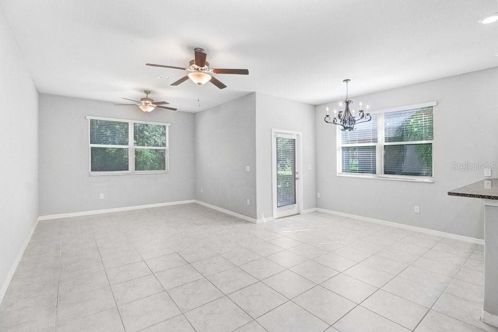 Living Room and Dining Room connected to Kitchen - 9536 PEMBROOKE PINES DR, SUN CITY CENTER