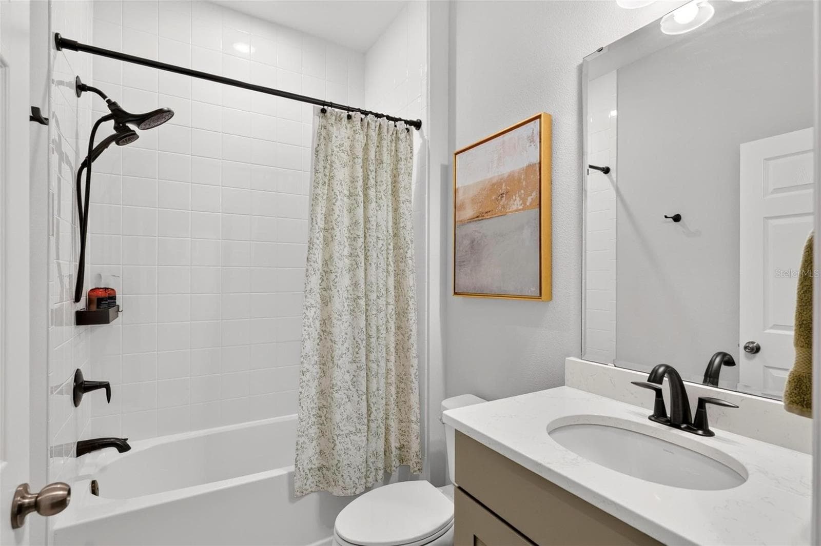 Downstairs bathroom (green cabinetry) - 14427 CRESTAVISTA AVE, CLERMONT