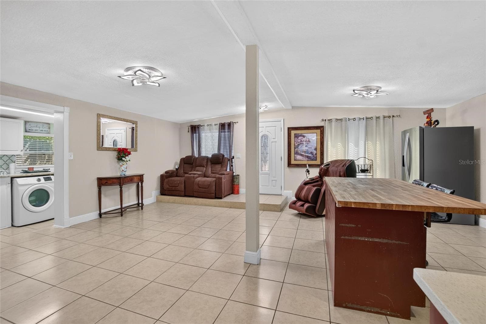 Straight ahead is the main / front door. To the left shows the laundry area. - 1727 WAIKIKI WAY, TAMPA