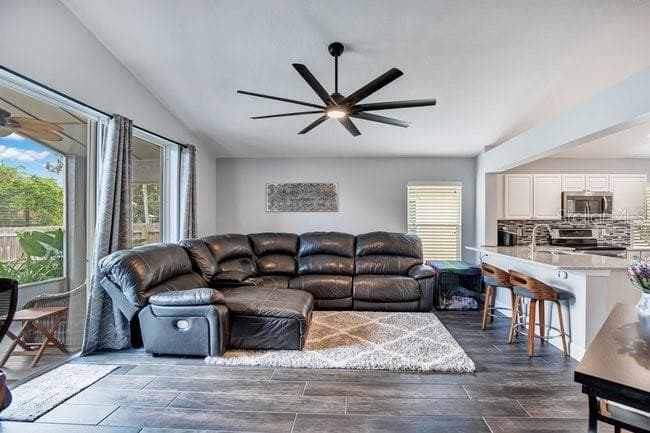 FAMILY ROOM AND KITCHEN - 650 REGINA LN, LAKE MARY
