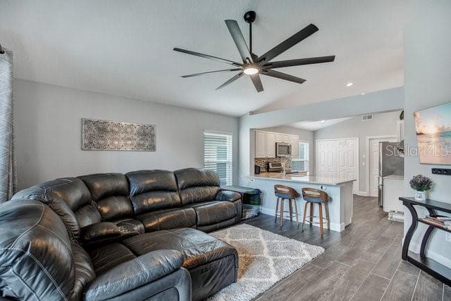 FAMILY ROOM AND KITCHEN - 650 REGINA LN, LAKE MARY