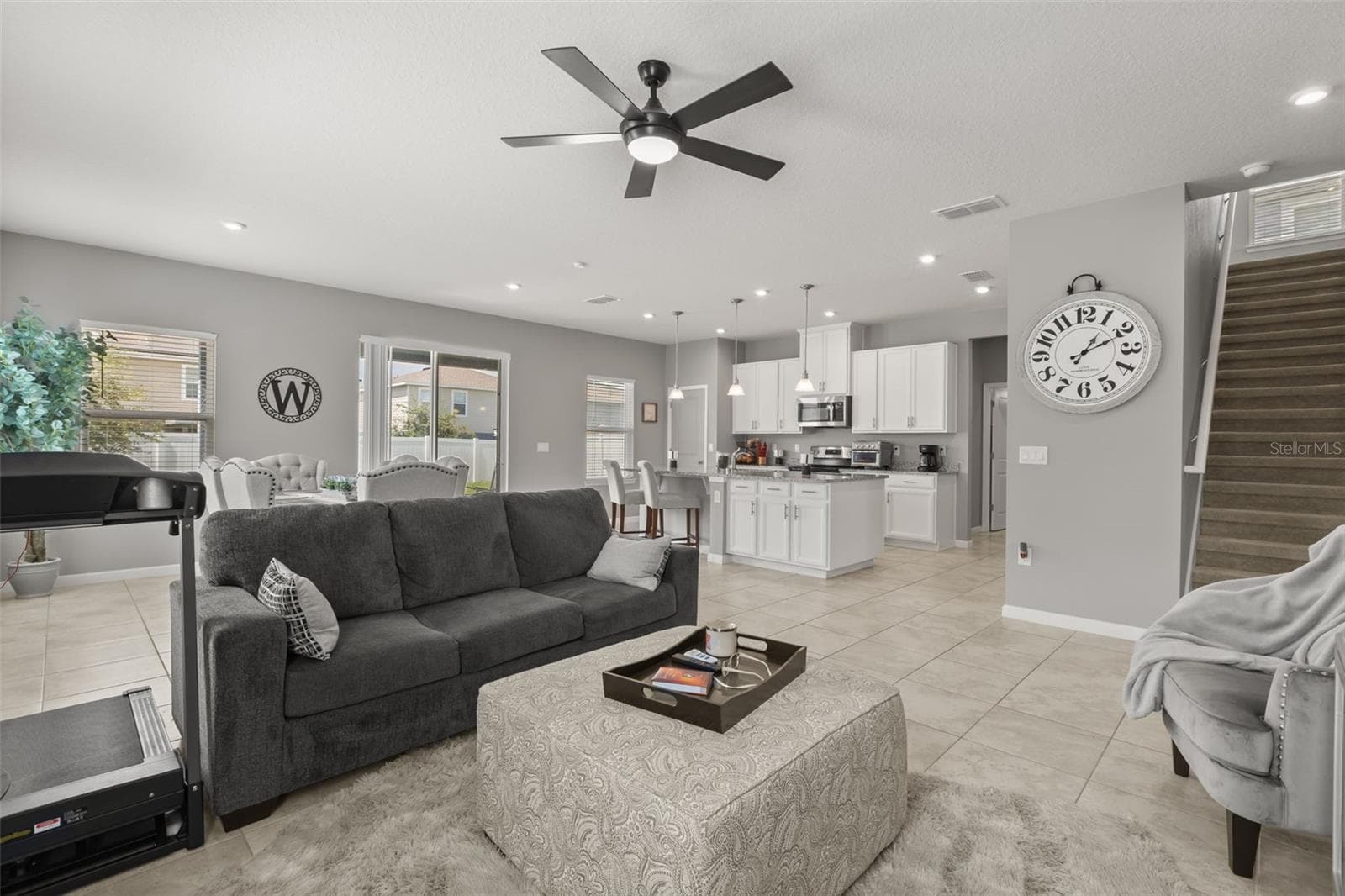 View from family room showing service island, kitchen, and staircase to second floor. - 1596 EUCALYPTUS WAY, DAVENPORT