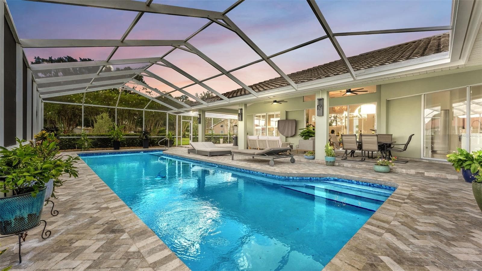 Gorgeous saltwater pool and lush landscaping create a relaxing retreat to enjoy. - 3417 BARLEY CT, LAKELAND
