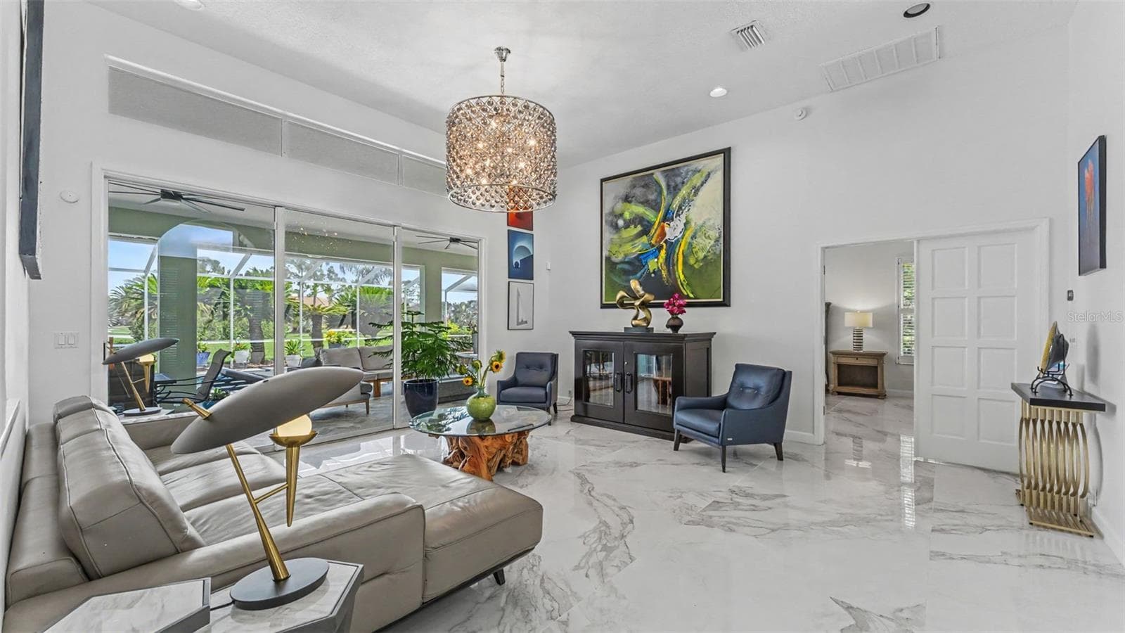 Living Room with sliders leading out to lanai - perfect for parties! - 3417 BARLEY CT, LAKELAND