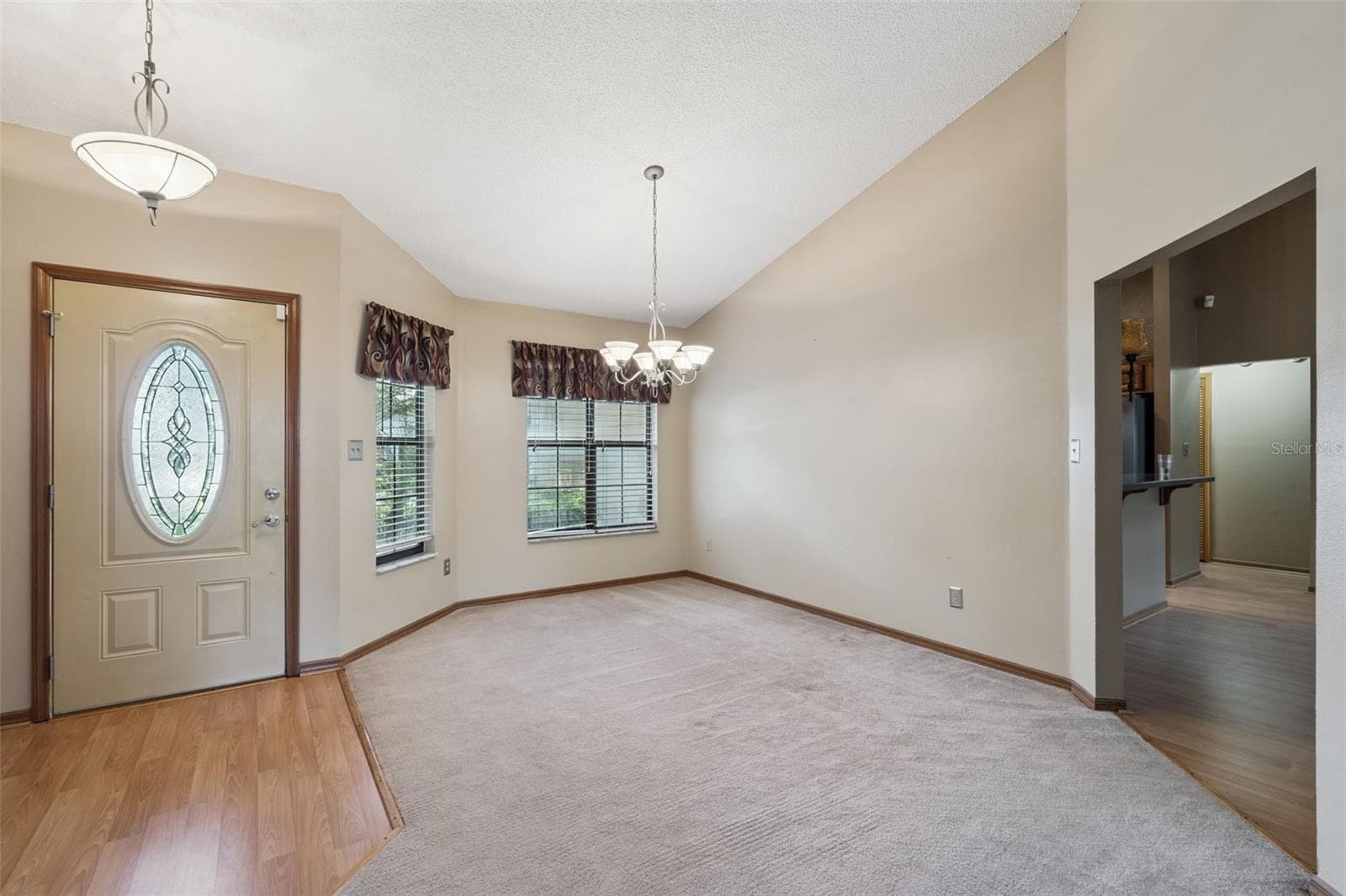 Welcoming foyer opens to a bright, spacious formal dining room with vaulted ceilings. - 288 RINGWOOD DR, WINTER SPRINGS