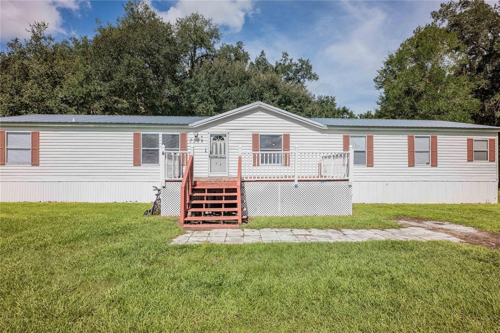Manufactured Home at 7309 RYMAN LOOP, ZEPHYRHILLS, photo 2 of 39
