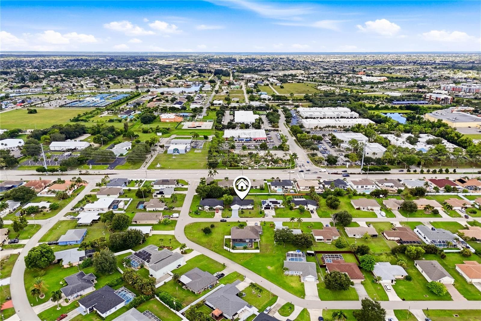 WELL-MAINTAINED + EXTENSIVELY RENOVATED + NO HOA + CITY UTILITIES w/ PAID ASSESSMENTS - 256 SE SANTA BARBARA PL, CAPE CORAL