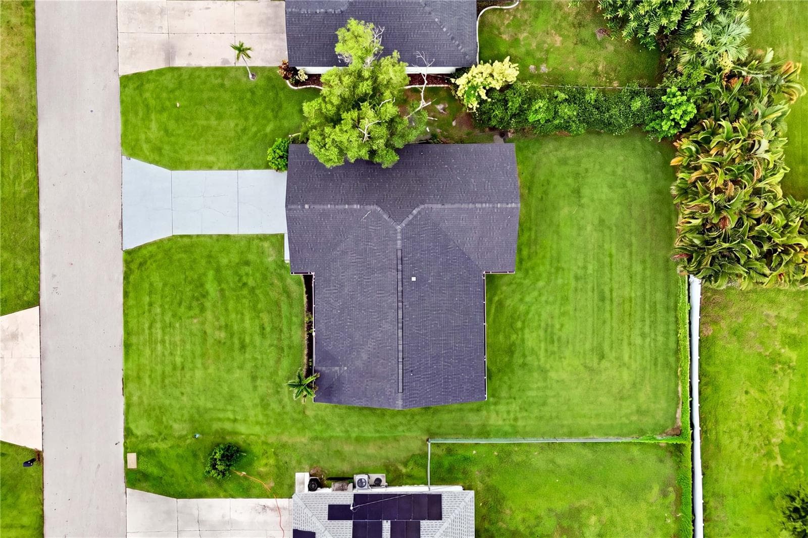 Major improvements include 2023 NEW ROOF, GOODMAN A/C, WATER HEATER & HURRICANE-IMPACT EXTERIOR DOORS + PATIO SLIDERS! - 256 SE SANTA BARBARA PL, CAPE CORAL