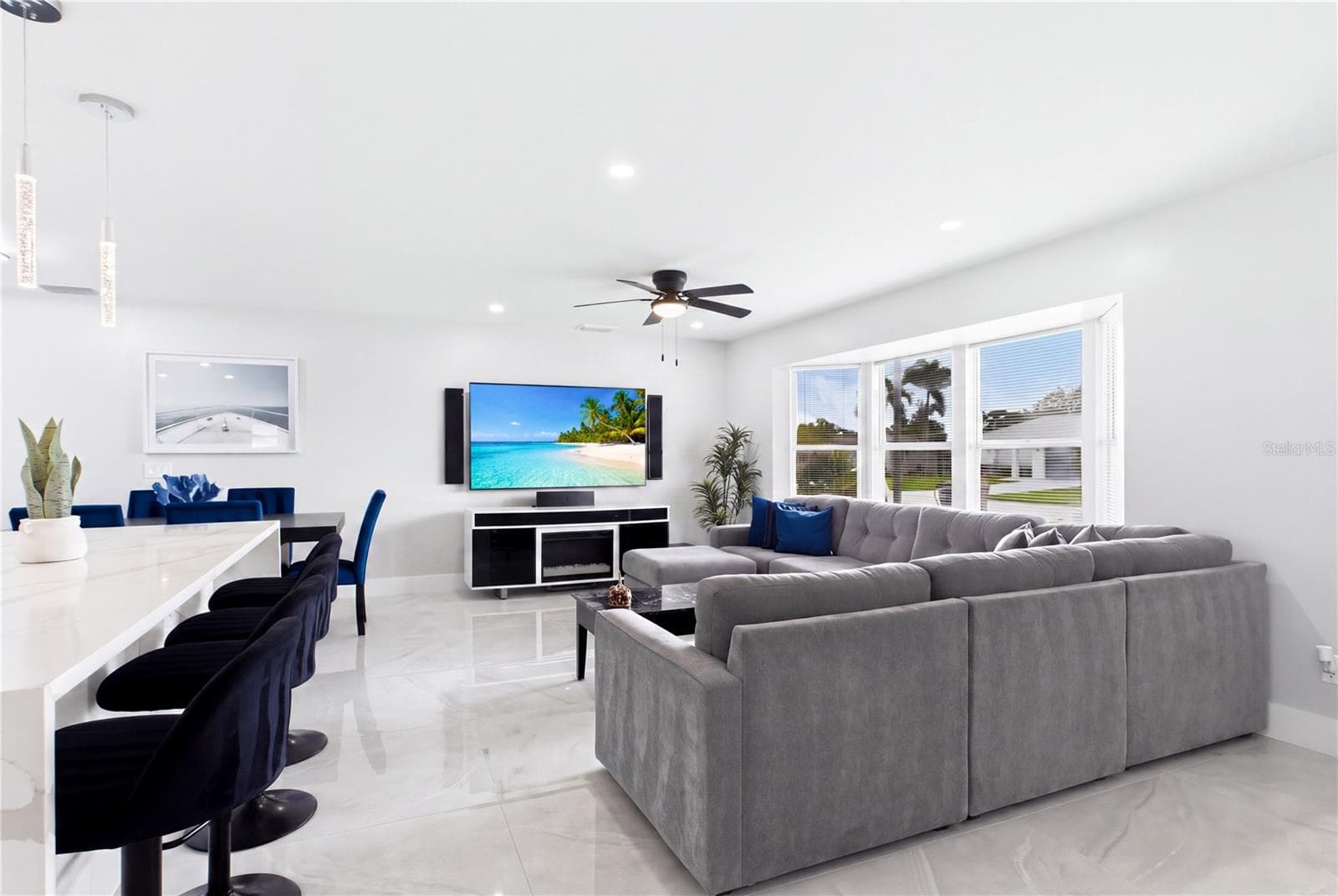 Clean neutral finishes & contemporary lighting enhance the home's fresh, MOVE-IN-READY feel. - 256 SE SANTA BARBARA PL, CAPE CORAL