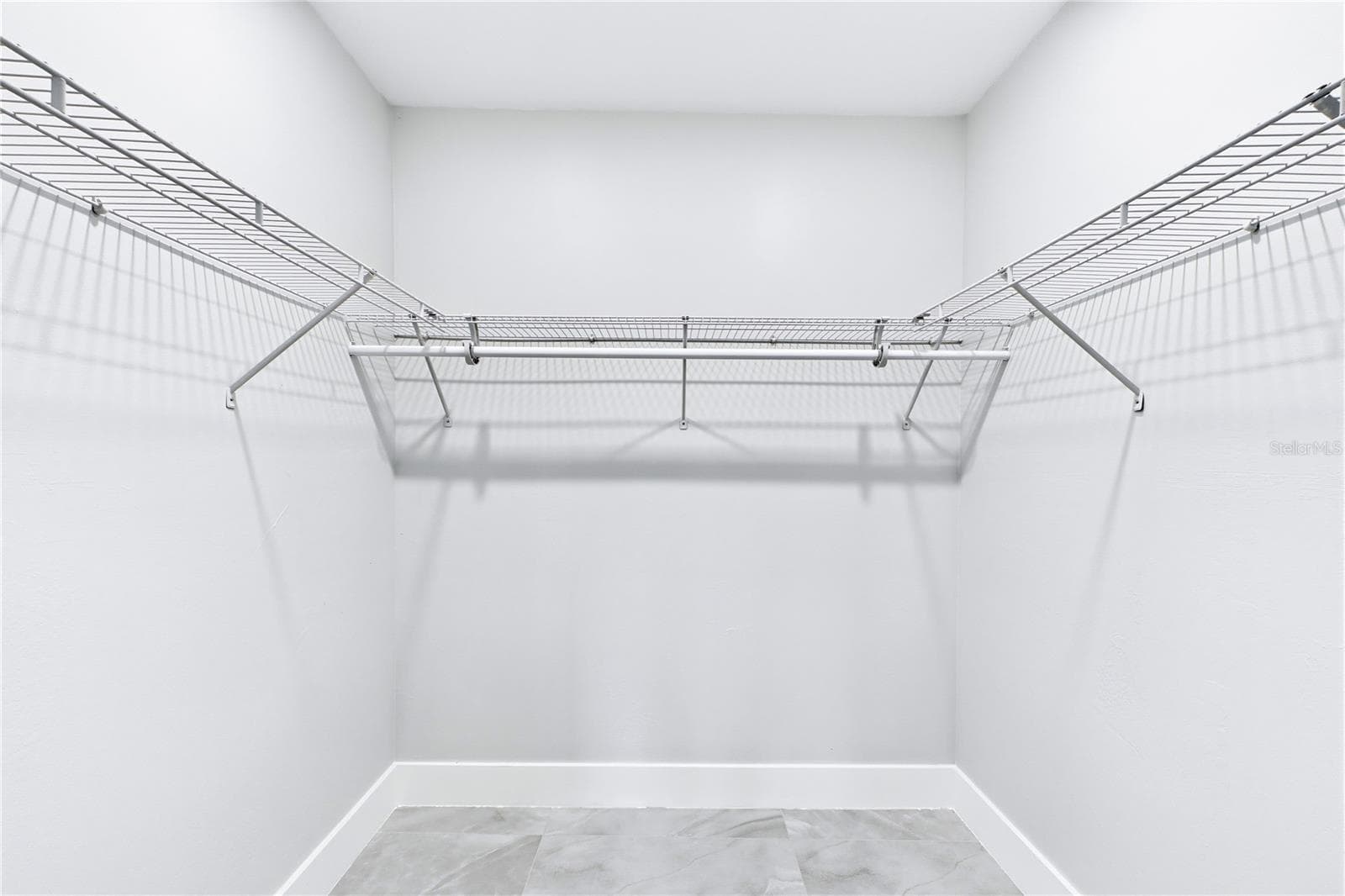 Impressive WALK-IN CLOSET provides abundant shelving & storage space to keep everything beautifully organized. - 256 SE SANTA BARBARA PL, CAPE CORAL