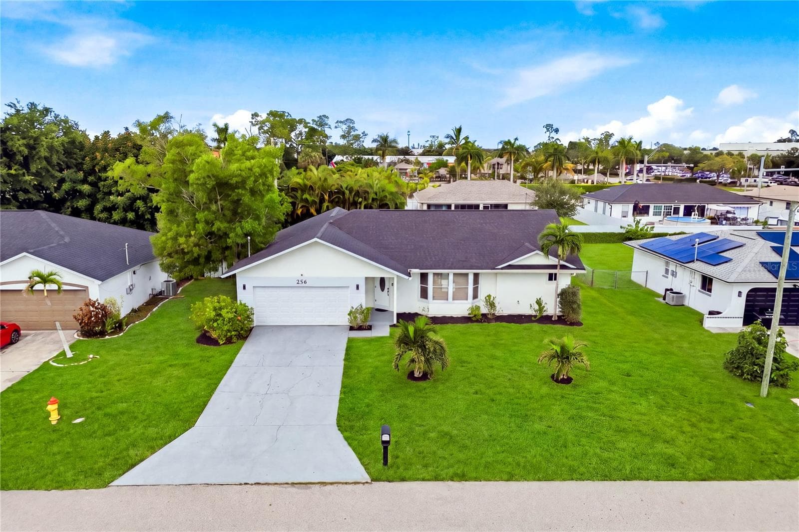 The aerial views showcase an EXCEPTIONAL CENTRAL CAPE CORAL LOCATION surrounded by shopping, dining, recreation & everyday conveniences. - 256 SE SANTA BARBARA PL, CAPE CORAL