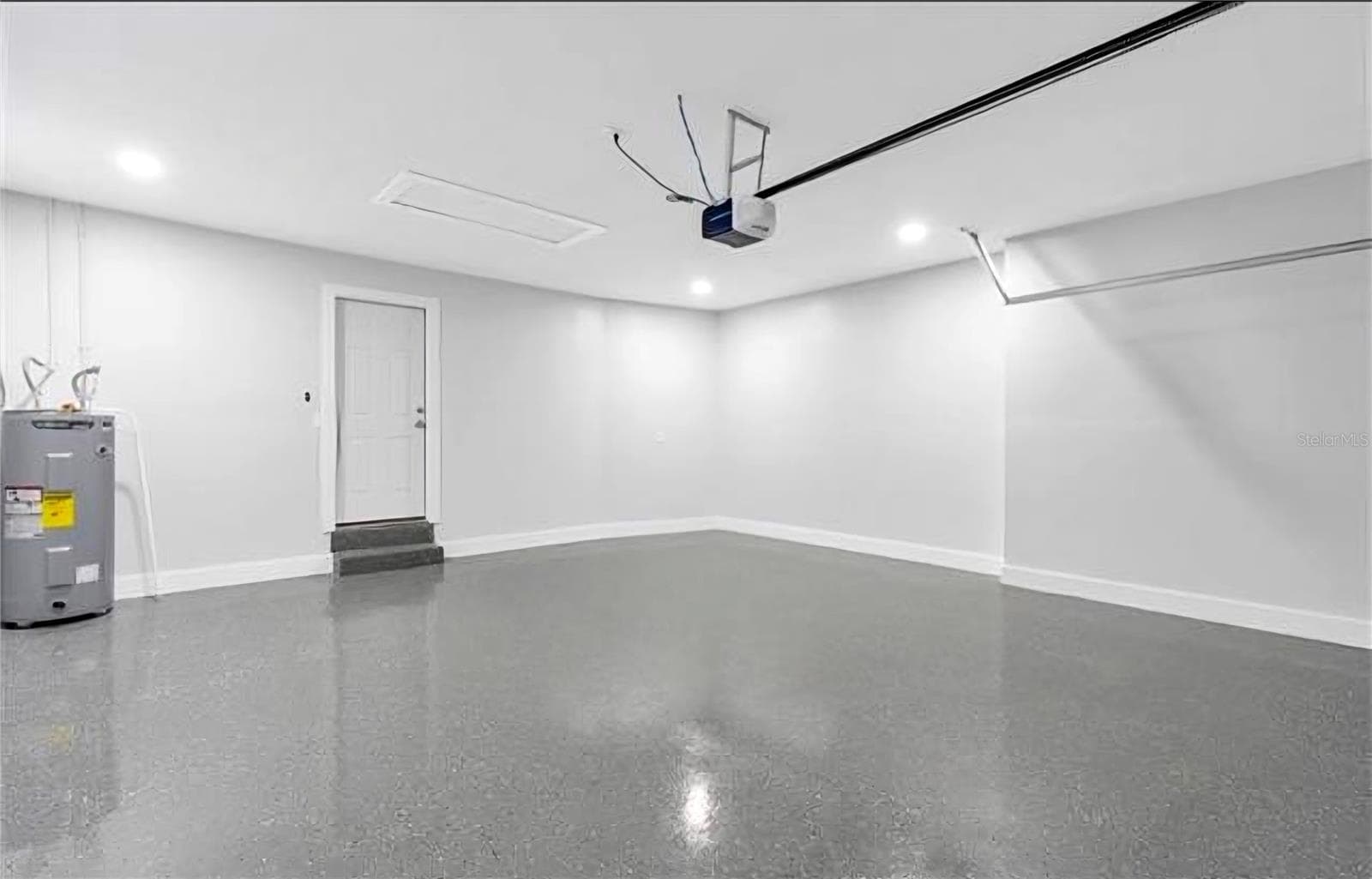 The GARAGE features EPOXY FLOORING & upgraded lighting - 256 SE SANTA BARBARA PL, CAPE CORAL