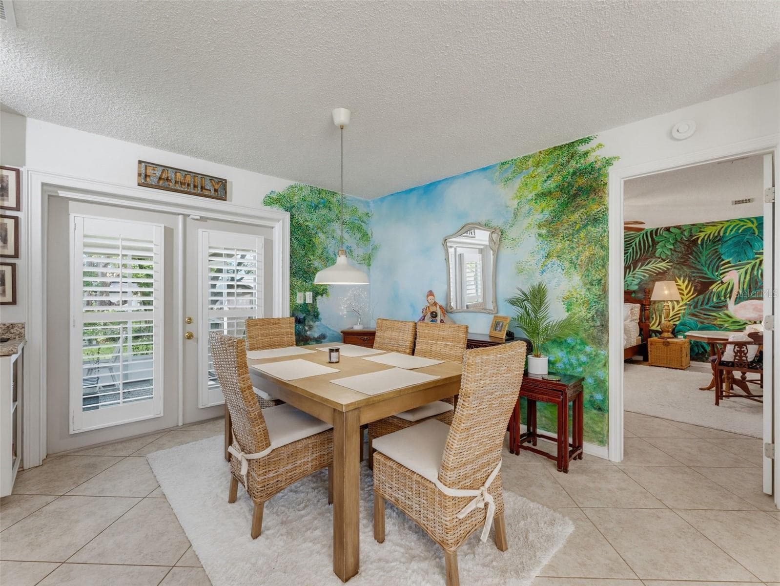 BEAUTIFUL FRENCH DOORS WITH PLANATION SHUTTERS IN THE DINING AREA - 11113 NORVELL RD, SPRING HILL