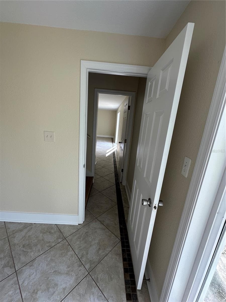 Lower bedroom into Bonus Room - 10 SUNNYSIDE DR, CLERMONT