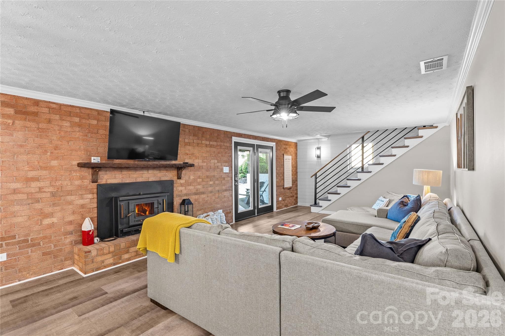 Fire place with insert in the lower living area - 150 Shady Cove Drive, Troutman