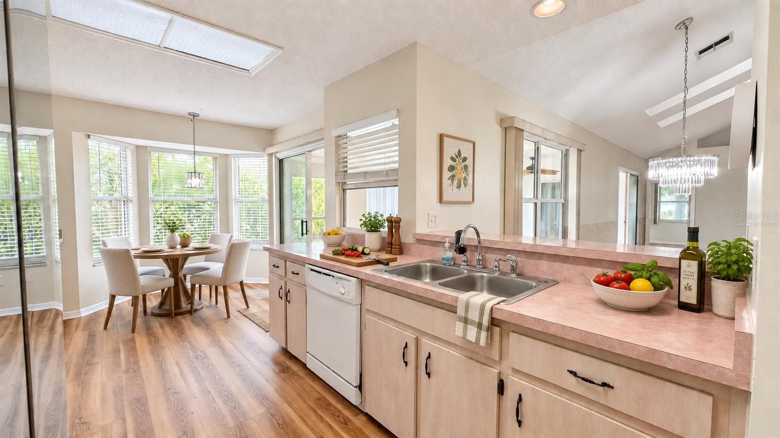 Large kitchen with breakfast room facing the backyard. Virtually staged. - 6501 SW 84TH PLACE RD, OCALA