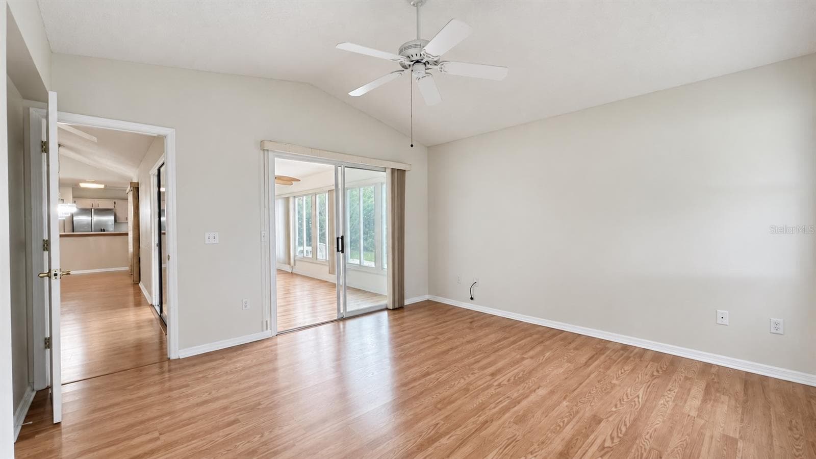 Master bedroom facing the side and lanai features large WIC and bath. - 6501 SW 84TH PLACE RD, OCALA