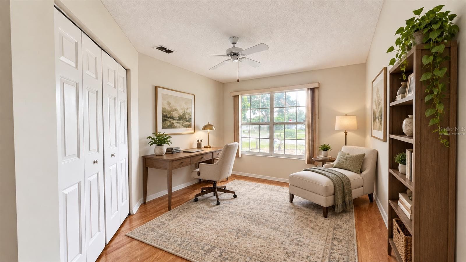 1 of 3 total bedrooms, this one features double door entry. Virtually staged as a home office/library. - 6501 SW 84TH PLACE RD, OCALA
