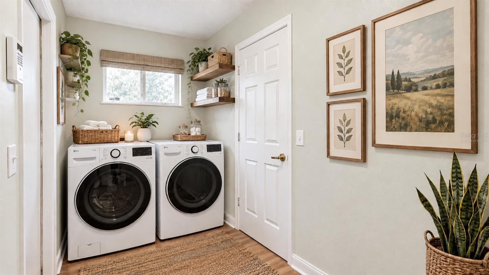Large laundry room with tons of storage possibilities on the opposite side. Virtually staged. - 6501 SW 84TH PLACE RD, OCALA