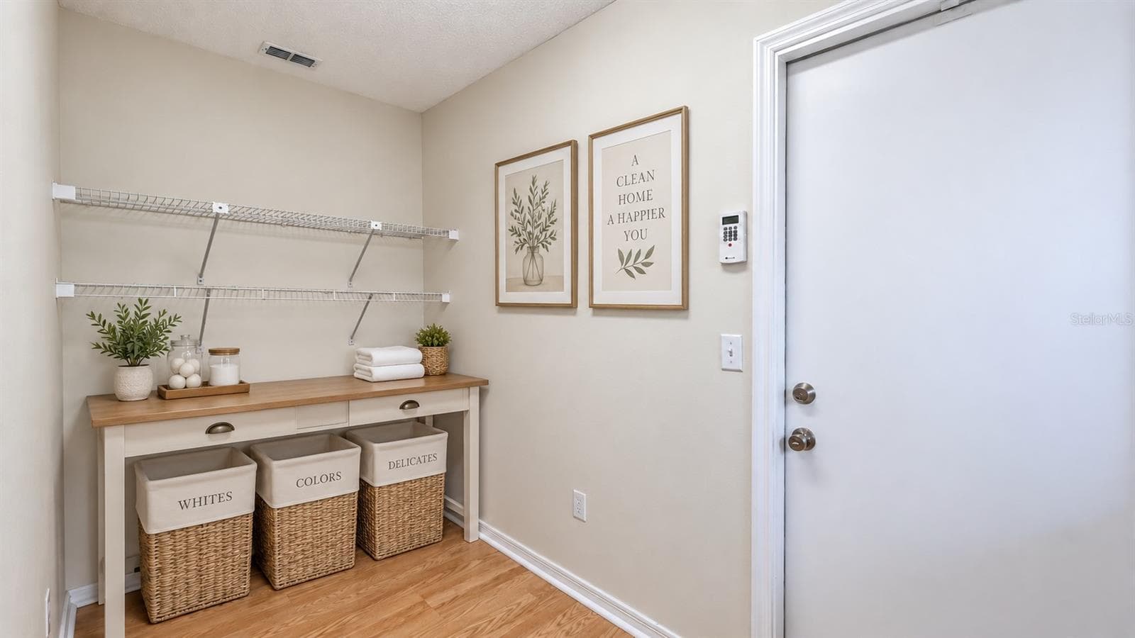 Large laundry room with tons of storage possibilities. W/D on the other side. Door leads to garage. - 6501 SW 84TH PLACE RD, OCALA