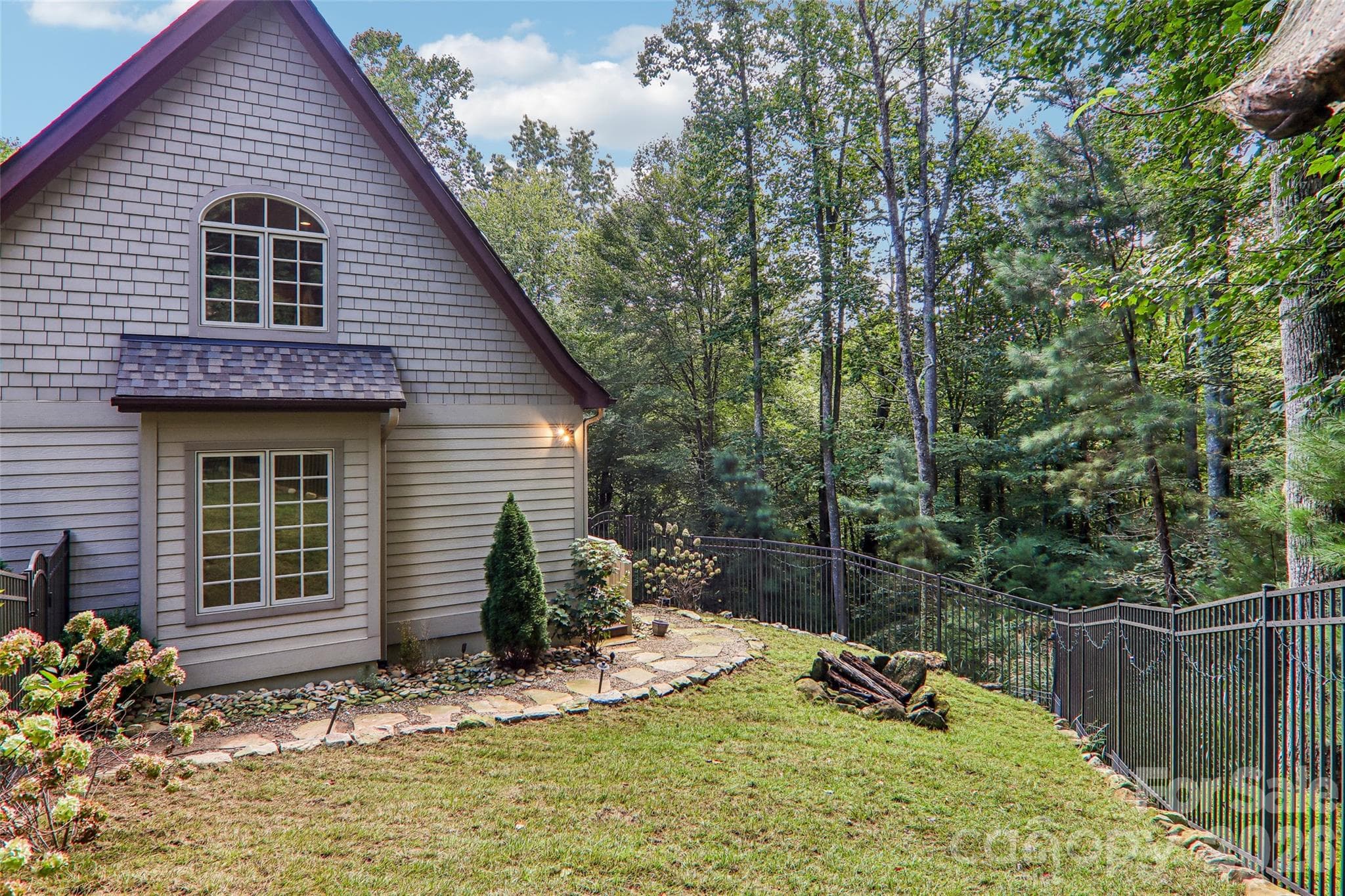 Partially fenced backyard area - 361 Mills River Way, Horse Shoe