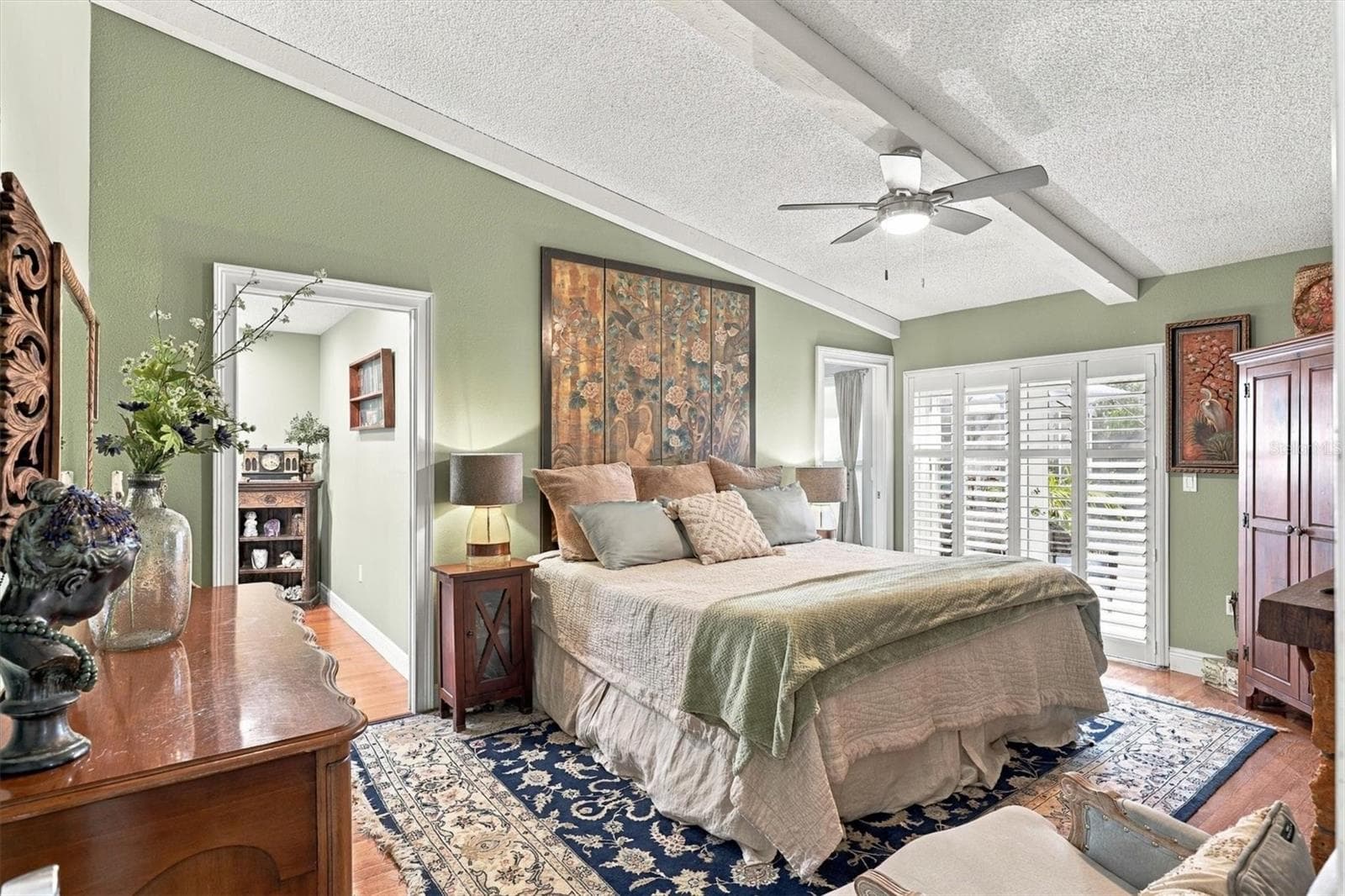 Primary bedroom with door to pool area. - 3828 EASTON ST, SARASOTA