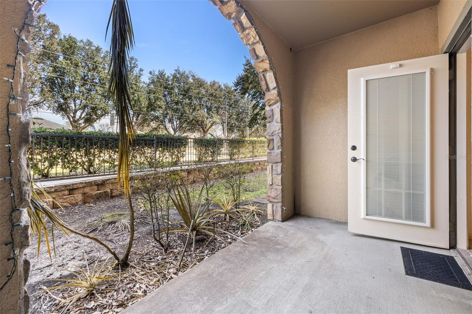 Private covered rear patio off the main living space - 901 CHARO PKWY #716, DAVENPORT