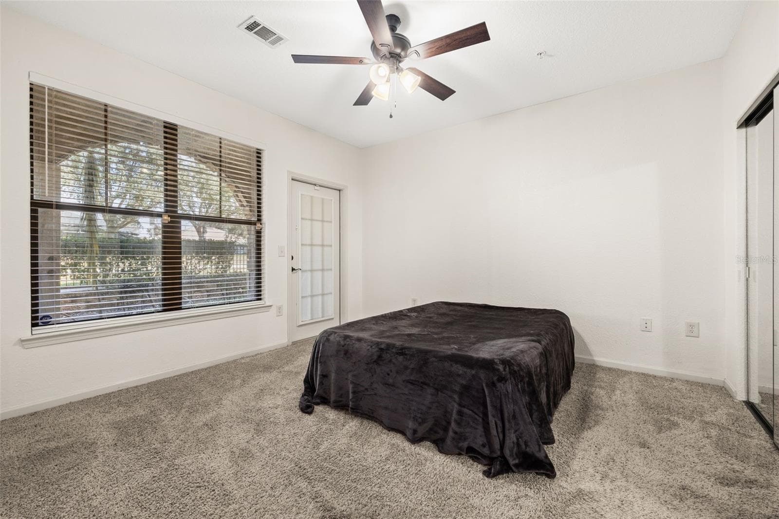 Window and private access to the rear patio - 901 CHARO PKWY #716, DAVENPORT