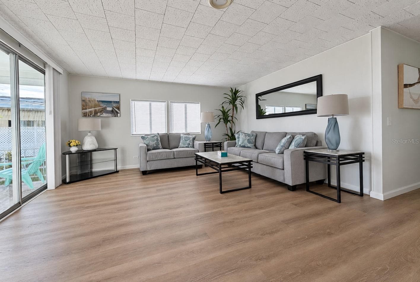 living room with new furniture - 1100 BELCHER RD S #64, LARGO