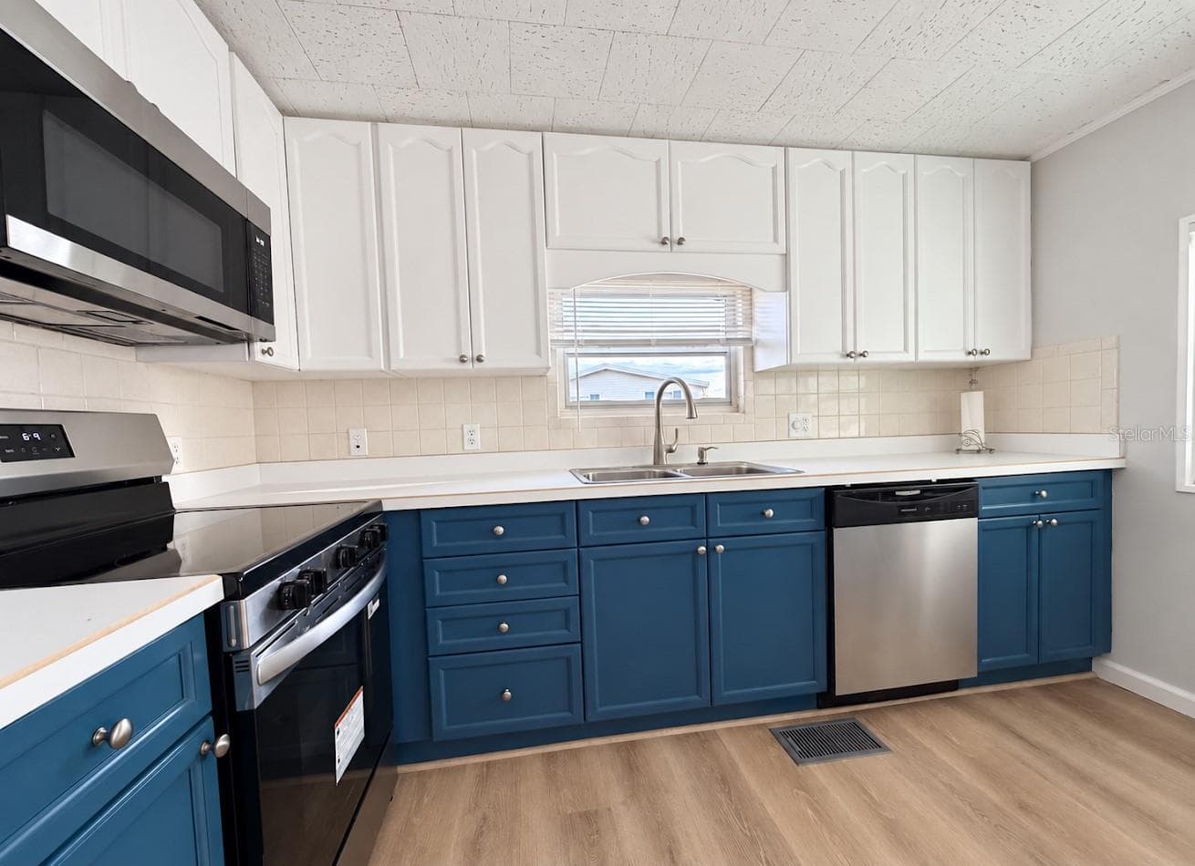 NEW appliances and sink under window - 1100 BELCHER RD S #64, LARGO