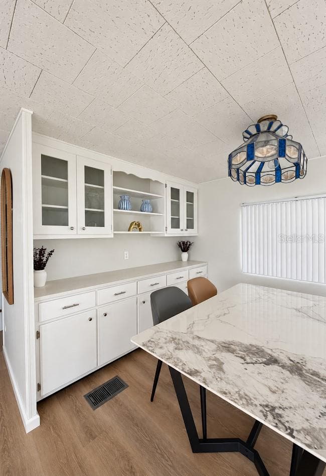 dining room with built in hutch - 1100 BELCHER RD S #64, LARGO