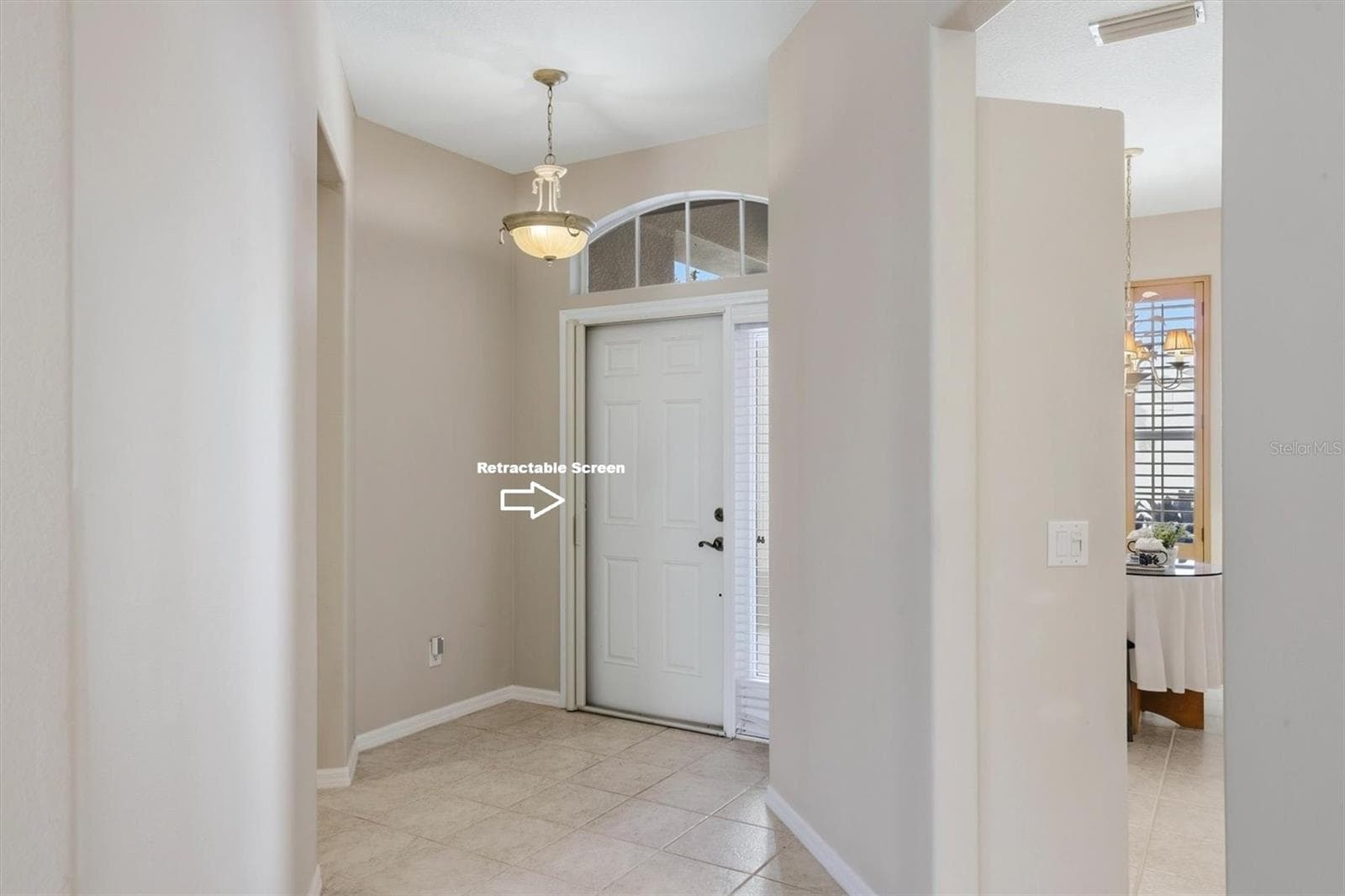 Foyer with Retractable Front Door Screen - 8138 VICTORIA FALLS CIR, SARASOTA
