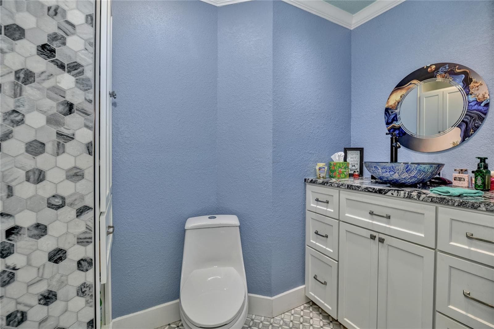 Primary bathroom updated vanity glass & mirror - 10958 SW 86TH CT, OCALA