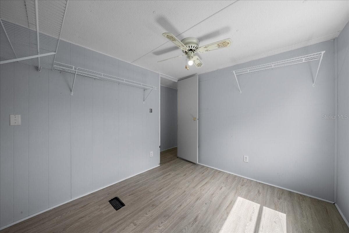 Guest Bedroom Features Ceiling Fan - 1314 TEAKWOOD LN, LADY LAKE