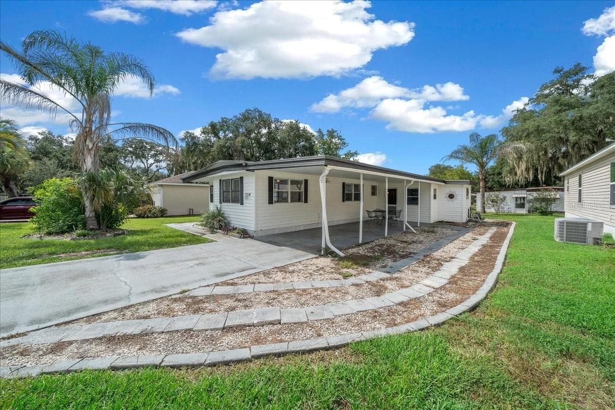 Side - 1314 TEAKWOOD LN, LADY LAKE