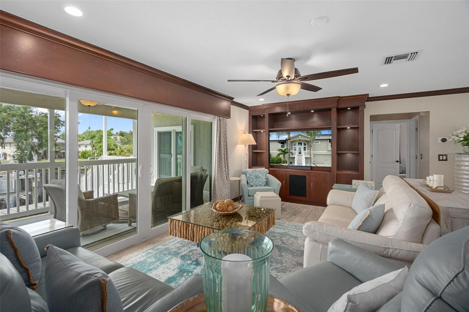 Living room with built-ins, RIVER FRONT view - 5517 TROPIC DR, NEW PORT RICHEY