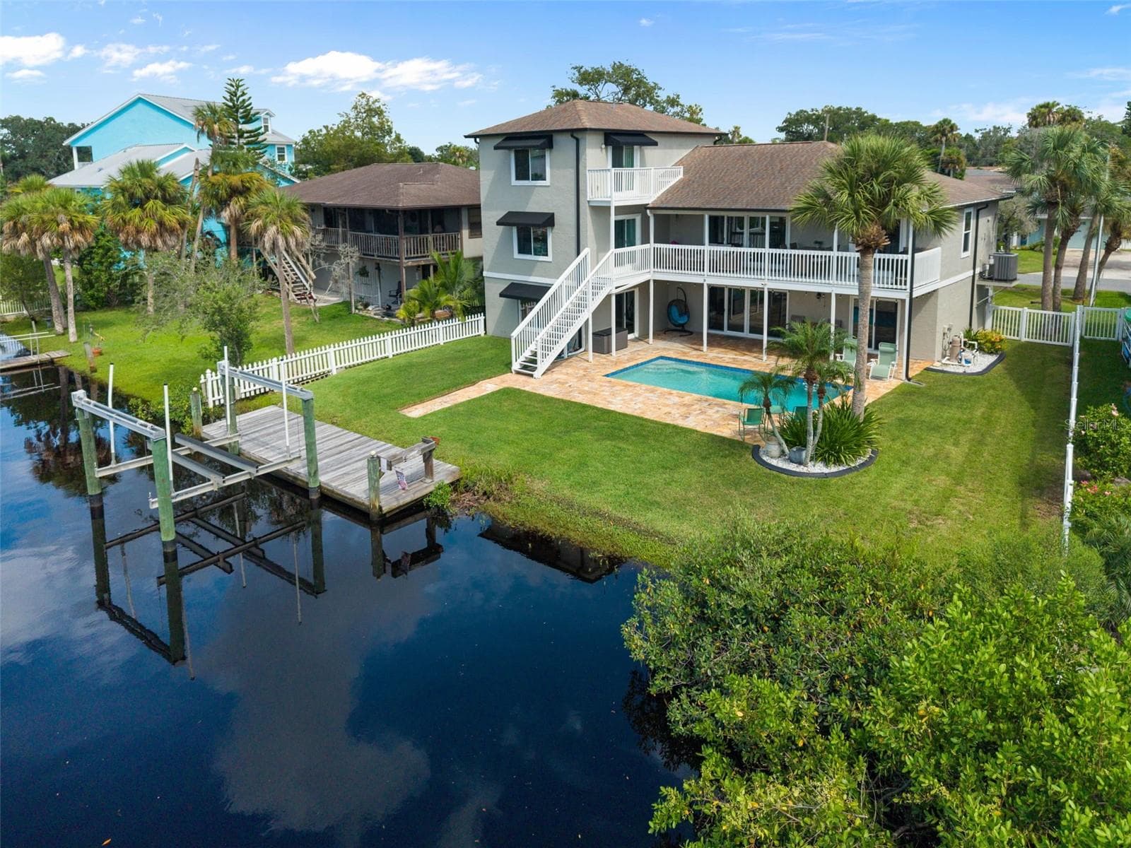 Rear view with dock and lift - 5517 TROPIC DR, NEW PORT RICHEY