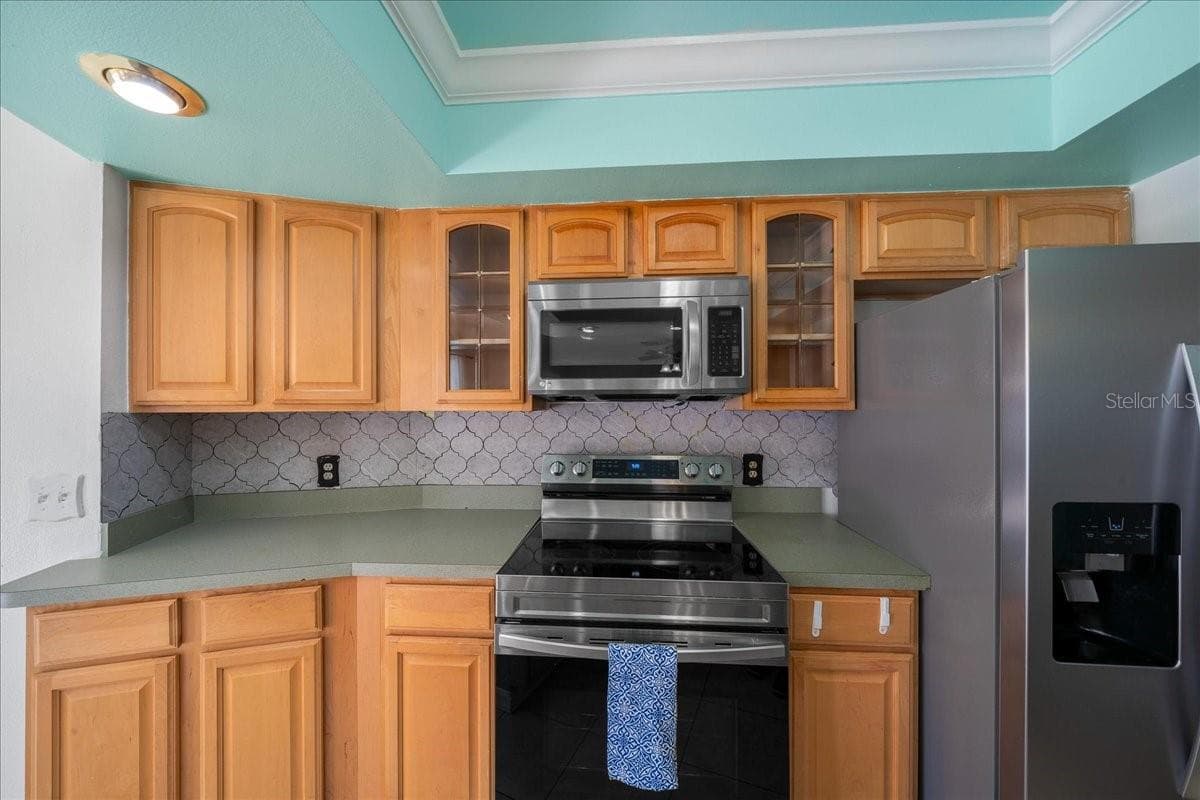 Stainless Steel Stove, Microwave, & Fridge - 14993 SW 38TH CIR, OCALA