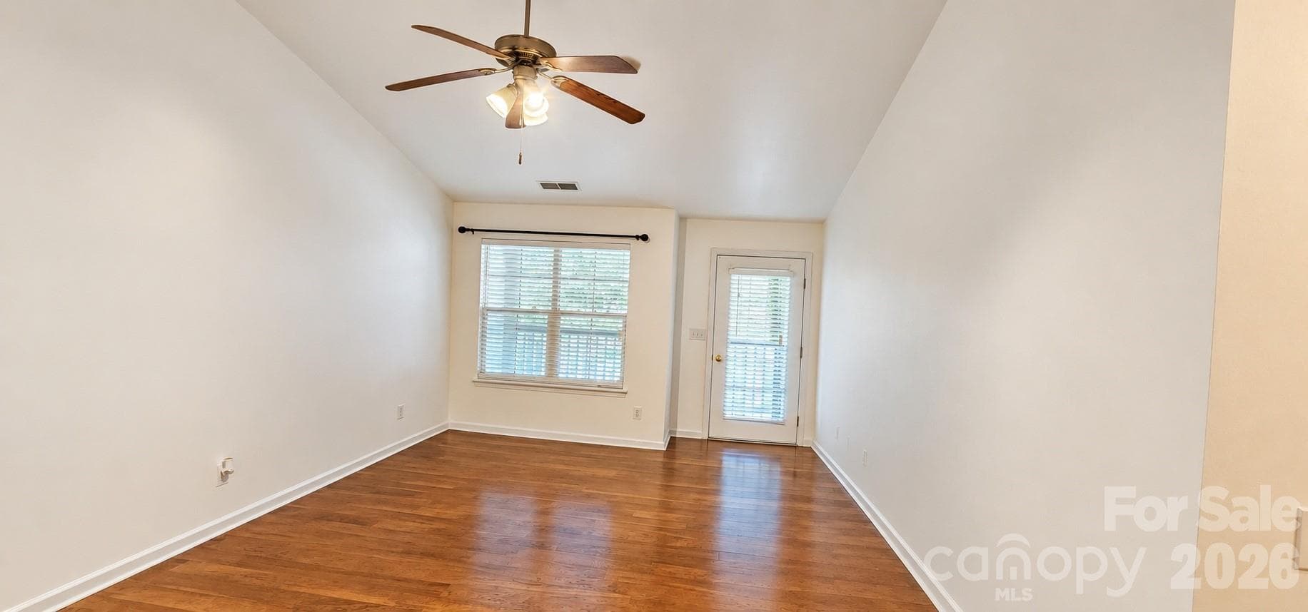 Living Rm View to Balcony (virtually empty) - 6552 Quarterbridge Lane, Charlotte